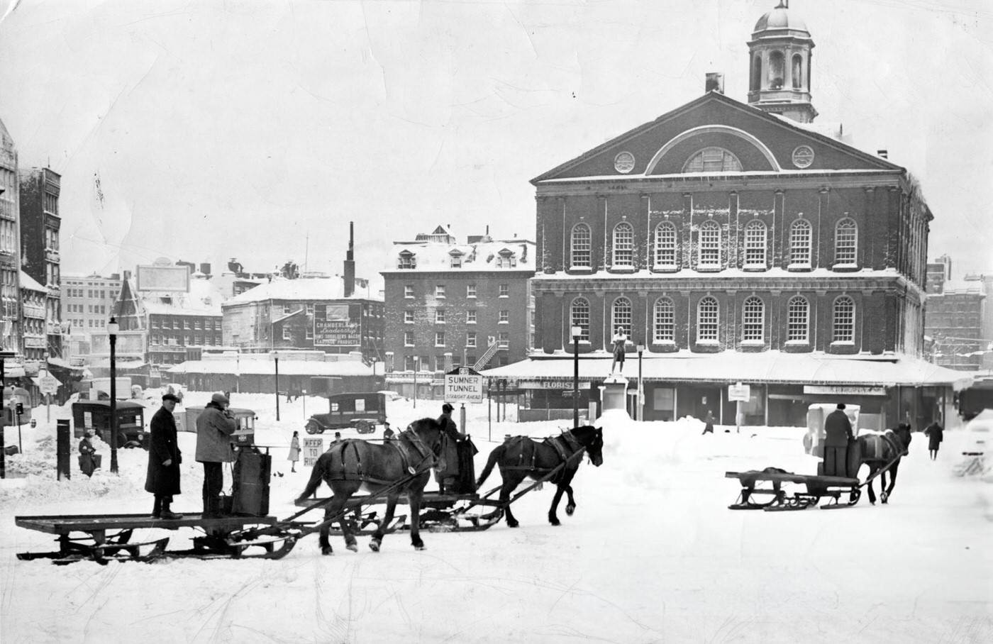 Snow in Boston, 1945. A horse-drawn carriage moves through the snow passed Faneuil Hall after a winter storm, 1945.