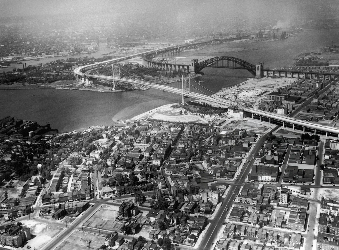 Aerial view of the Triborough Bridge with Hell Gate Bridge in the background, 1940s.