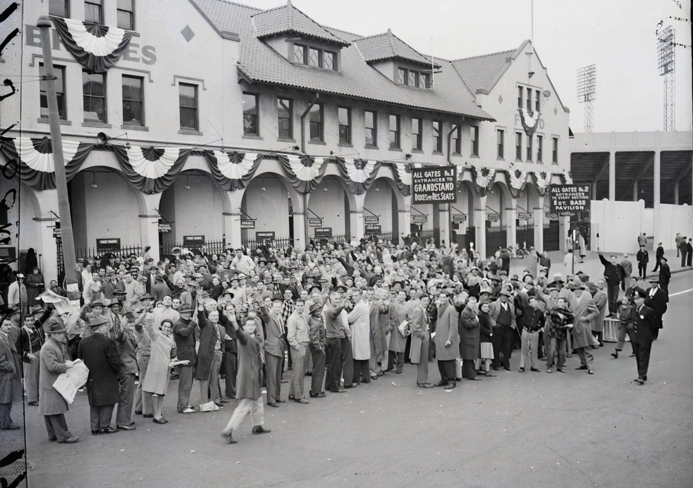 A crowd of fans besieged the ticket offices of the Braves field in Boston on the eve of the Series opening, 1948.