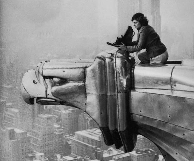 Margaret Bourke-White, a photographer, climbing the Chrysler Building, 1934.
