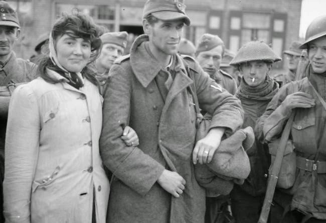 A Dutch woman refuses to leave her husband, a German soldier, after Allied soldiers capture him; she followed him into captivity, 1944.