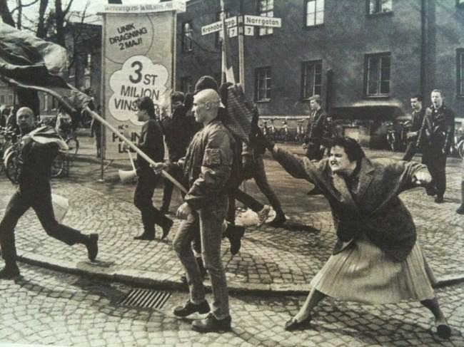 A Swedish woman hitting a neo-Nazi protester with her handbag; the woman was reportedly a concentration camp survivor, 1985.
