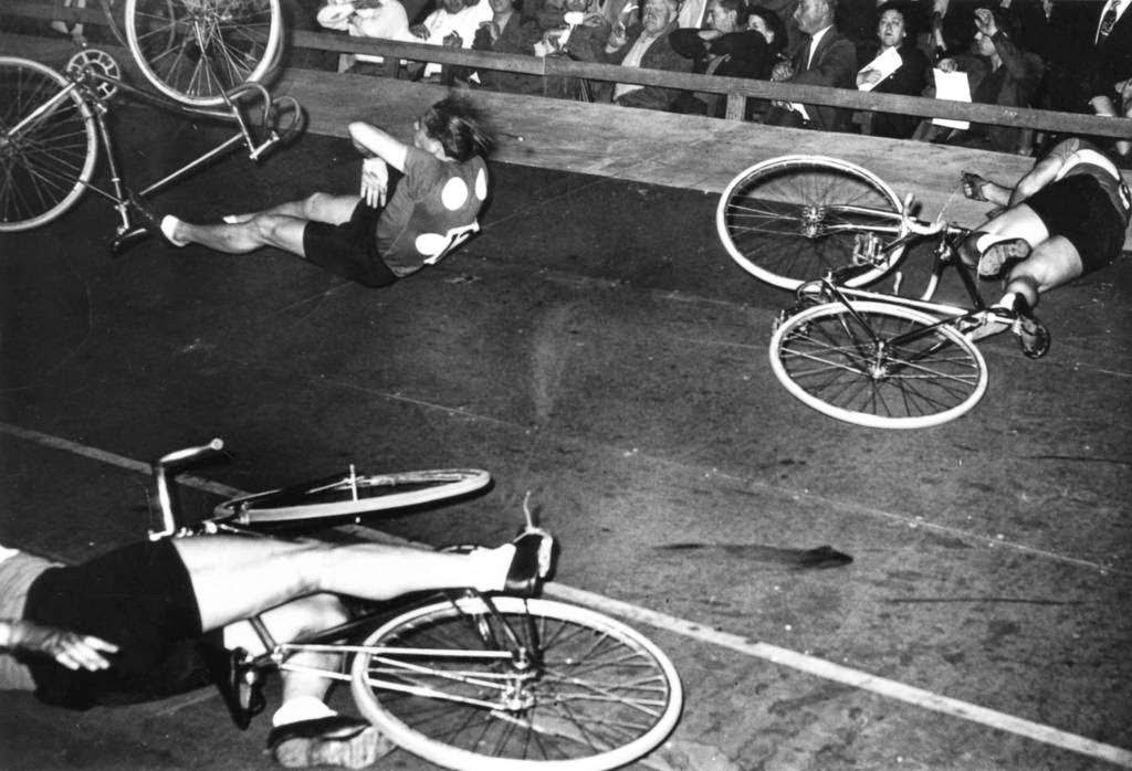 Bike racer Bill Jacoby during a race in the 1940s, where bike racing could be a dangerous sport with crashes and injuries.