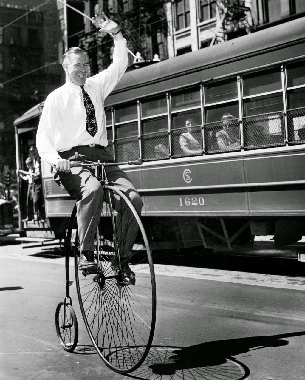 A man rides a Victorian-era bicycle in Chicago, 1947.