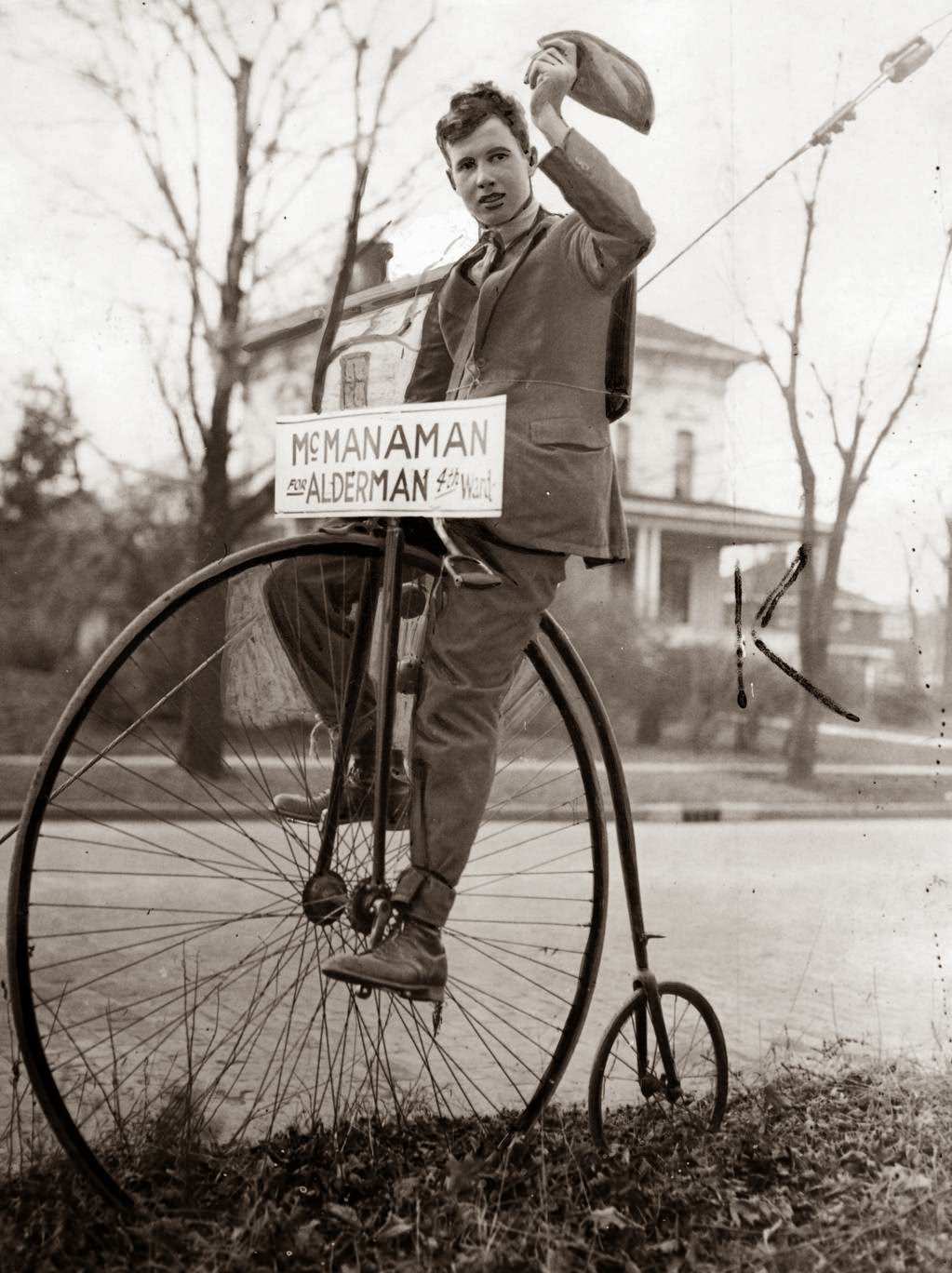 Joseph Fuller, of Waukegan, rides a mid-Victorian bicycle to help get votes for Frank McManaman, candidate for alderman from the Fourth Ward, 1931.