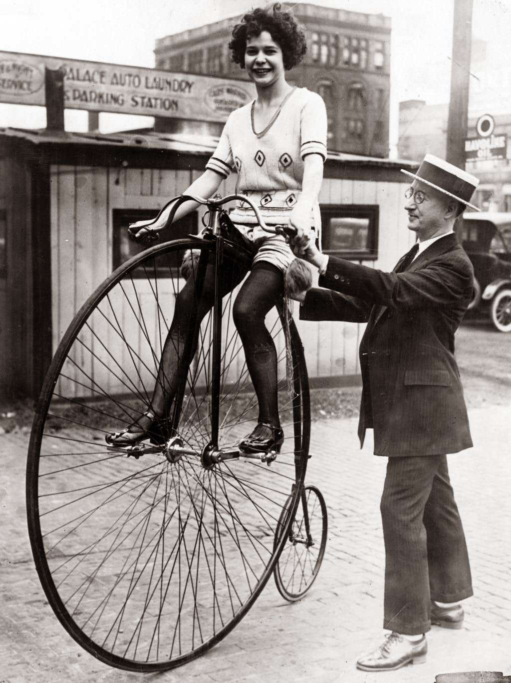 A woman on a Victorian-era bicycle in Chicago, 1922.