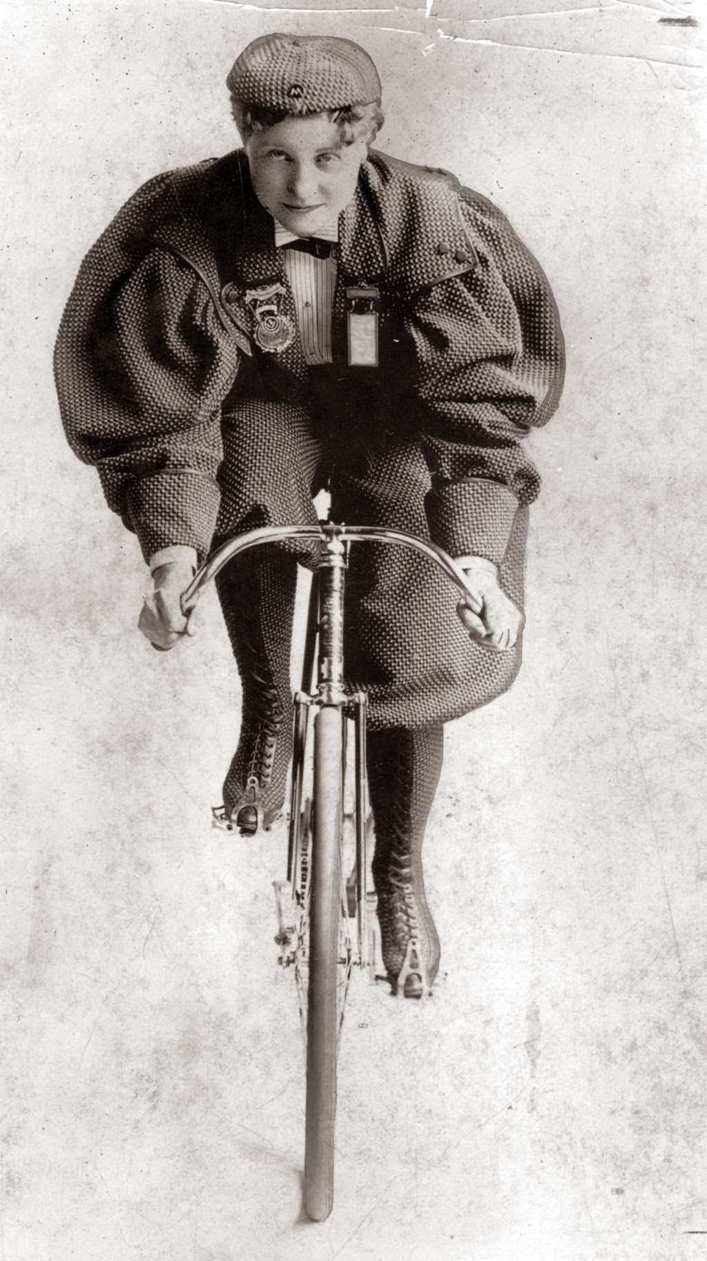 Tillie Anderson Shoberg, known as "Tillie the Terrible Swede" and the best female bicyclist in the late 1800s, wears a costume worn by women cyclists in the early 1890s, 1935.