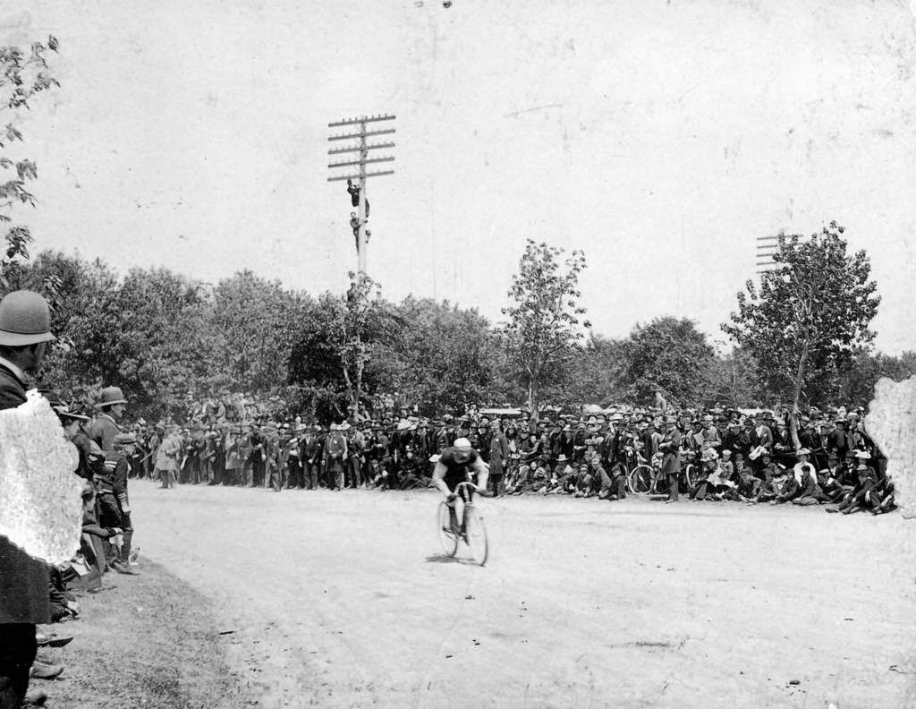 People gather to watch a bicycle race in the community of Englewood in Chicago, 1897.