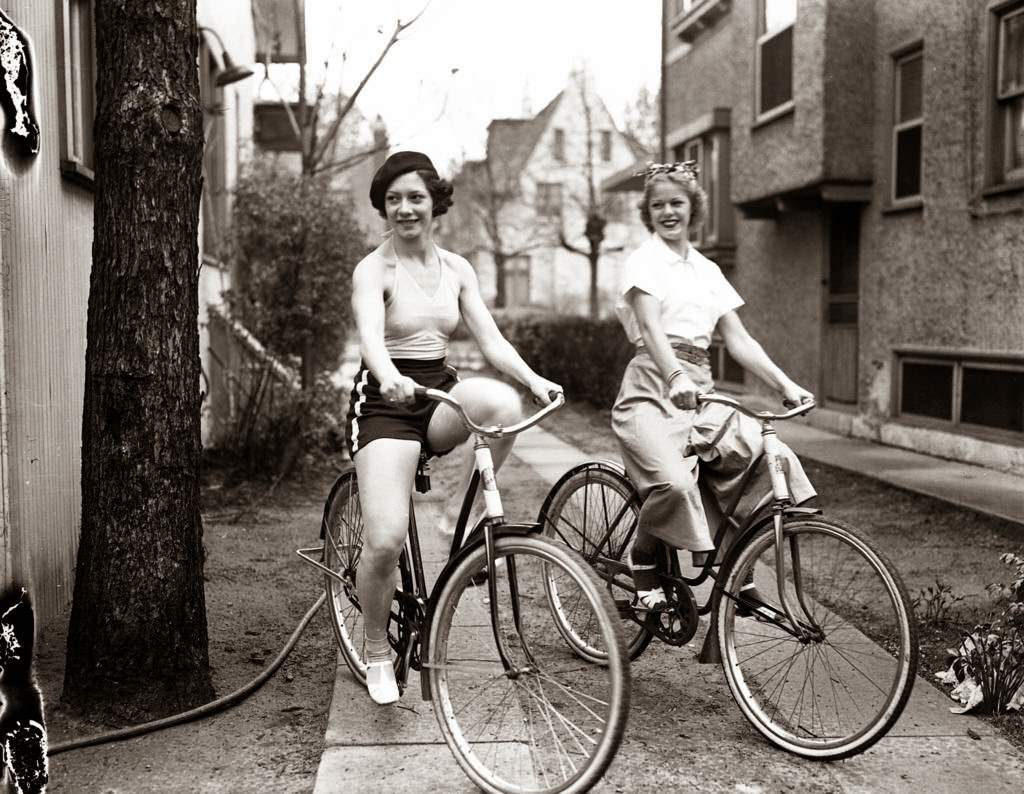 Ray and Geraldine Hudson, dancers known as "The Hudson Wonders" at the Bon-Air Country Club, on their bikes, 1937.