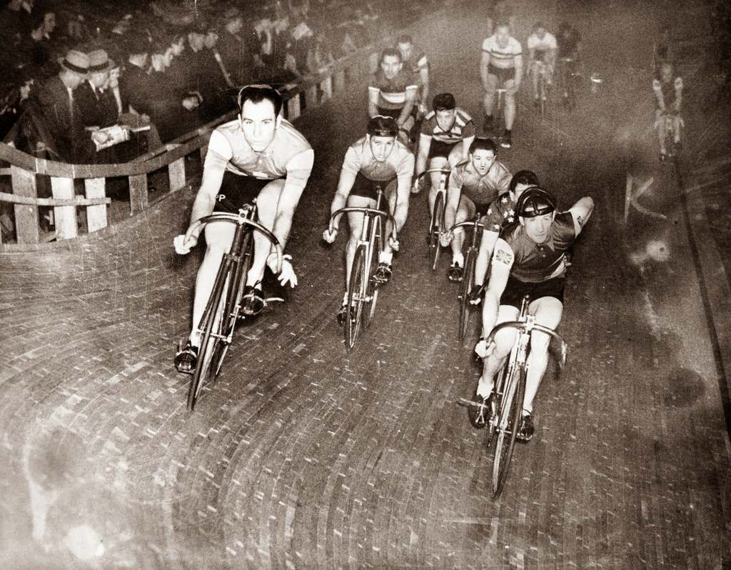 Heinz Vopel, of Dortmund, Germany, and Gerard Debaets, of Belgium, ride in front of the field at the start of a six-day race at the Chicago Stadium, 1939.