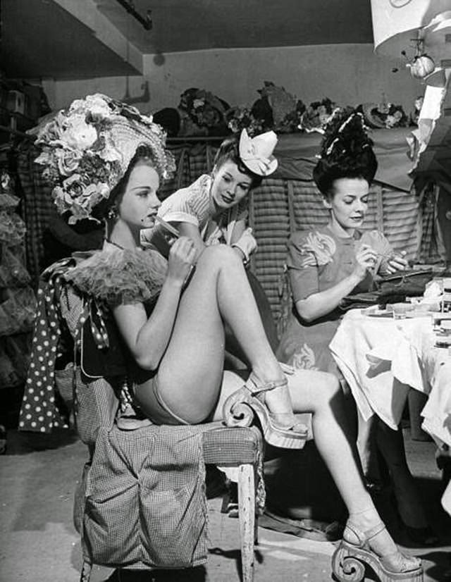 Chorus girls Diane Van Alst, Mara Williams, and Mary Mullens in the dressing room backstage at the Copacabana nightclub, 1940s.