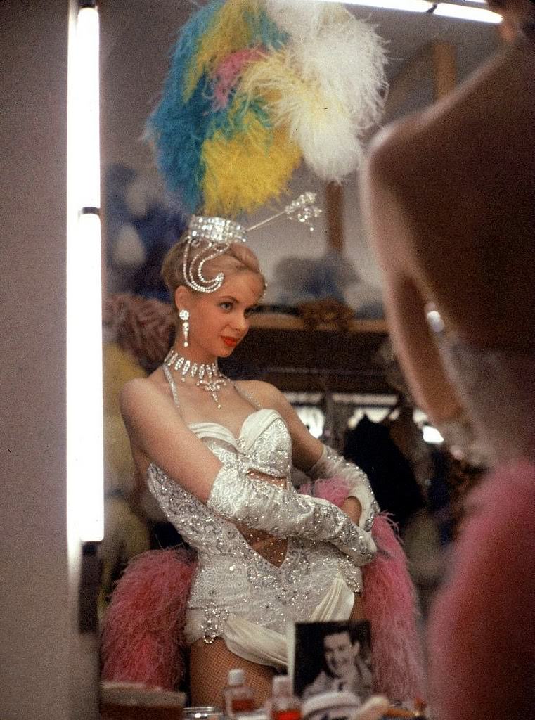 Chorus girl of the Bluebell Girls checking her costume in the dressing room of the Stardust hotel & casino before a performance, Las Vegas, 1959.