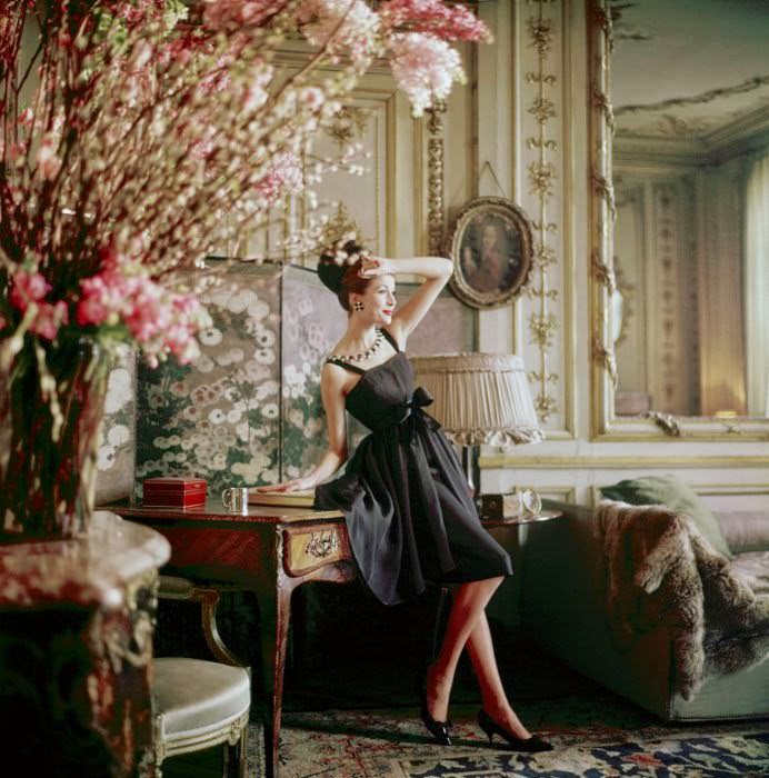 A Romance dress, Spring-Summer 1960 haute-couture collection, is modeled in the home of Suzanne Luling, Christian Dior’s couture director.