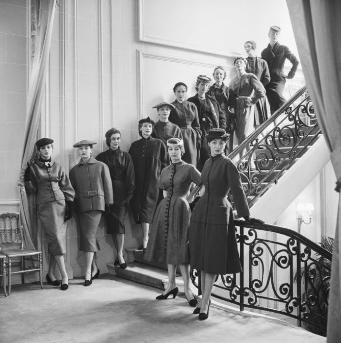 Thirteen models lined up on the staircase outside the Grand Salon before a highly anticipated trip to Japan, Autumn-Winter 1953 haute-couture collection.