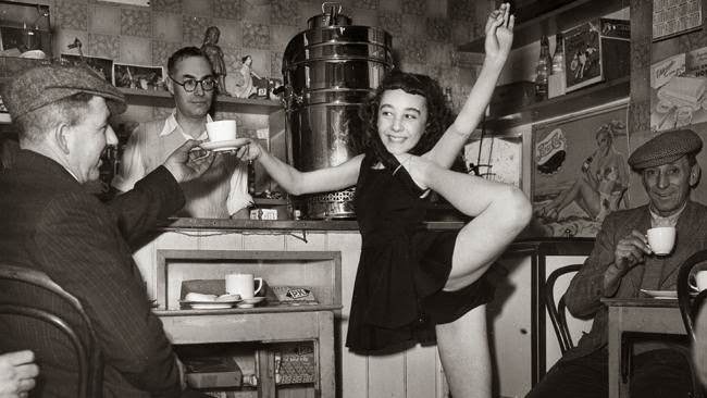 Acrobatic dancer Beryl Lapidge helps out in her father's cafe.