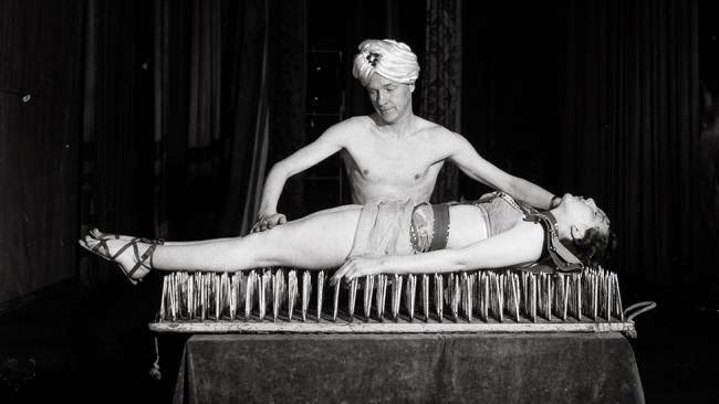 A fakir performing the bed of nails trick, 1955.