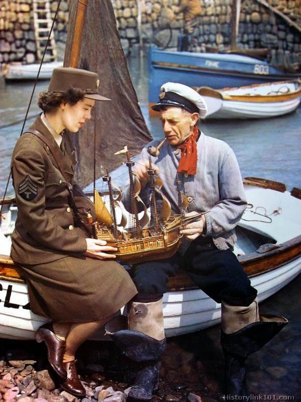 Somewhere in England a WAC learns about old sailing ships from a good authority.