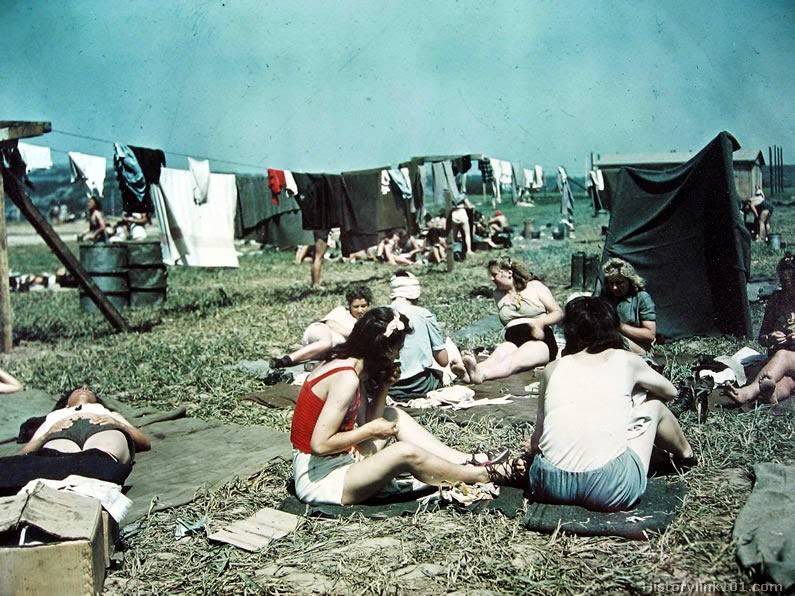 A few of the more than 500 women at the PW Camp, Sinzing, Germany taking sunbaths.