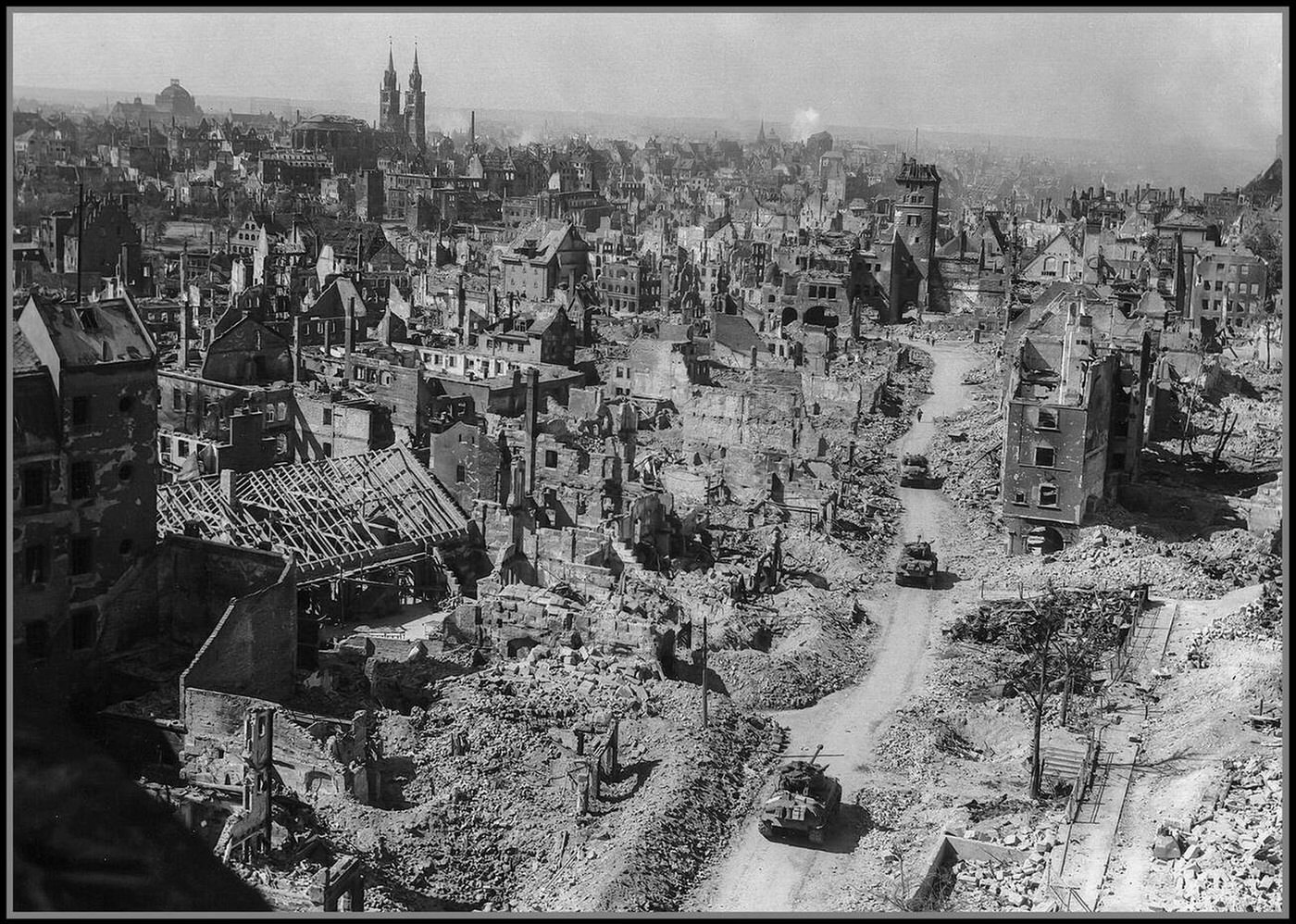 Allied tanks roll into a bomb shattered Nuremberg, 1945.