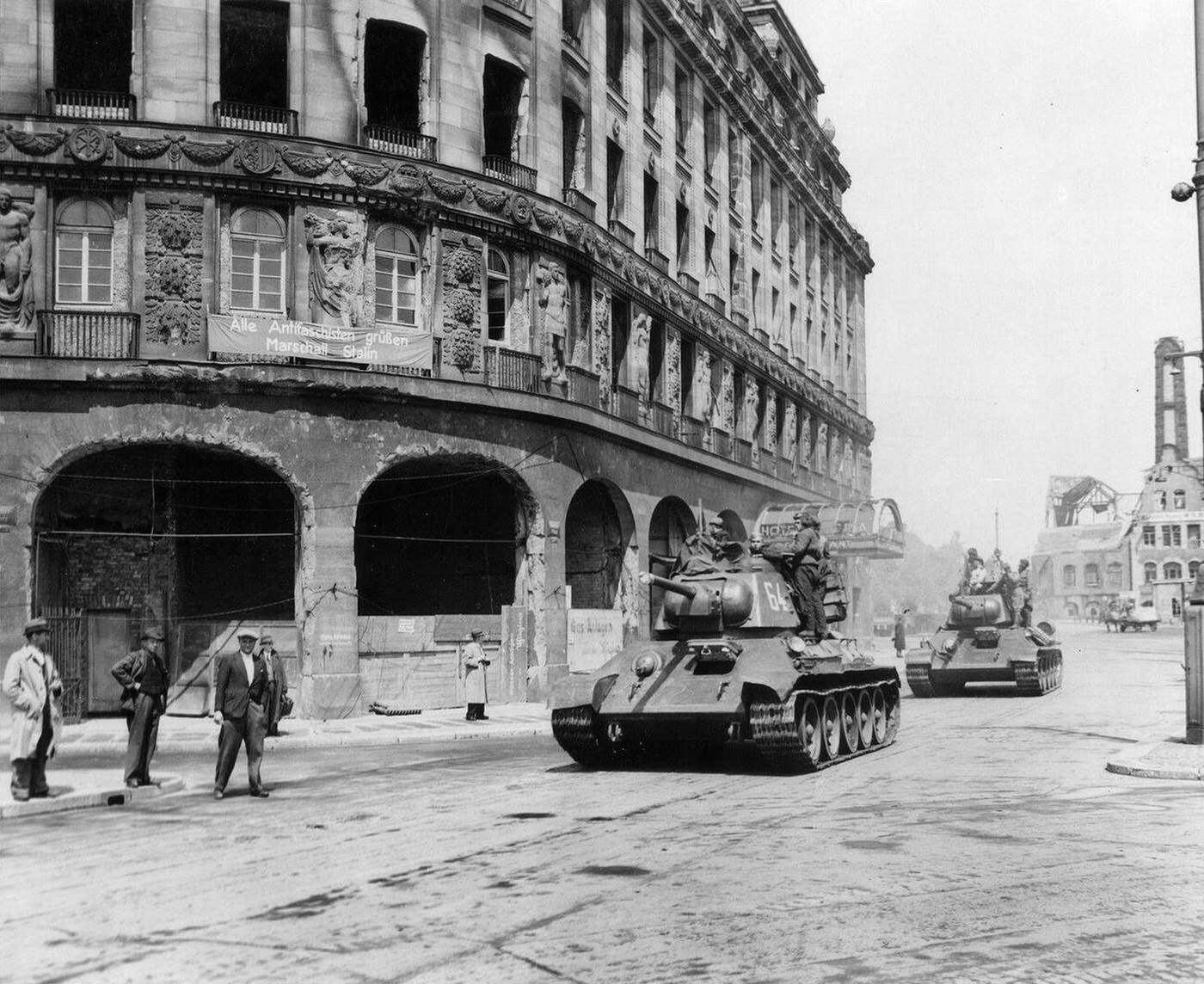 Red Army tanks in Leipzig during the Soviet advance through eastern Germany; the sign on the building reads "All anti-fascists welcome marshal Stalin".