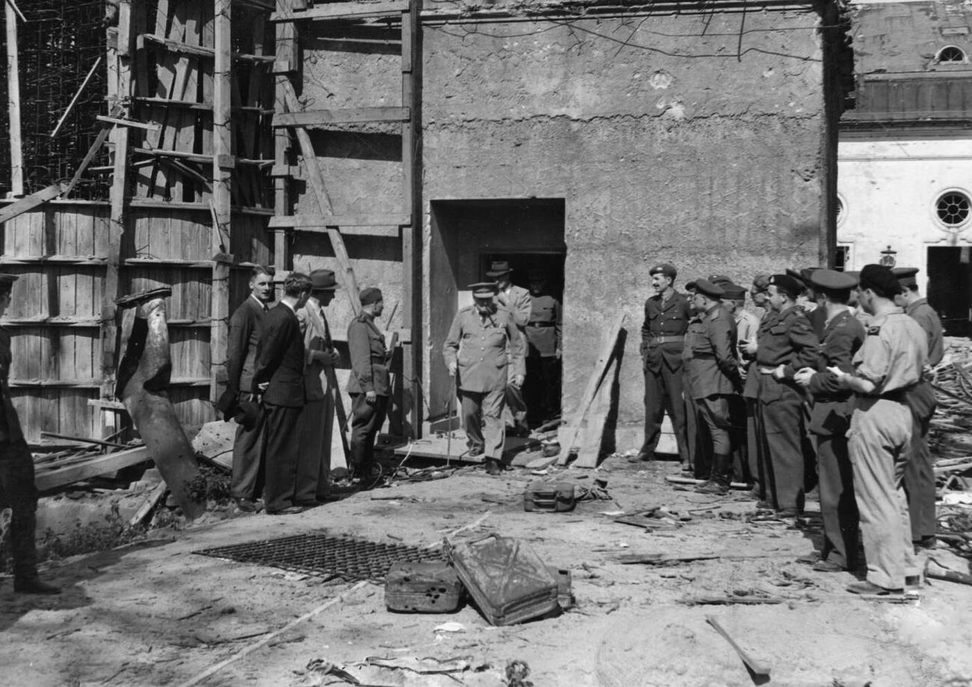 British Prime Minister Winston Churchill leaves the destroyed Reich Chancellery after the Second World War ended, Berlin, Germany, 1945.