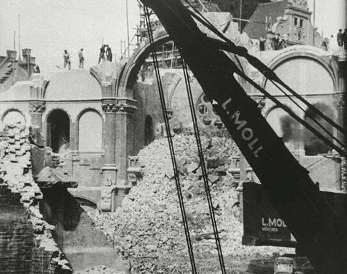 The Munich Synagogue, destroyed during the November Pogroms (Kristallnacht), with a crane in the foreground.