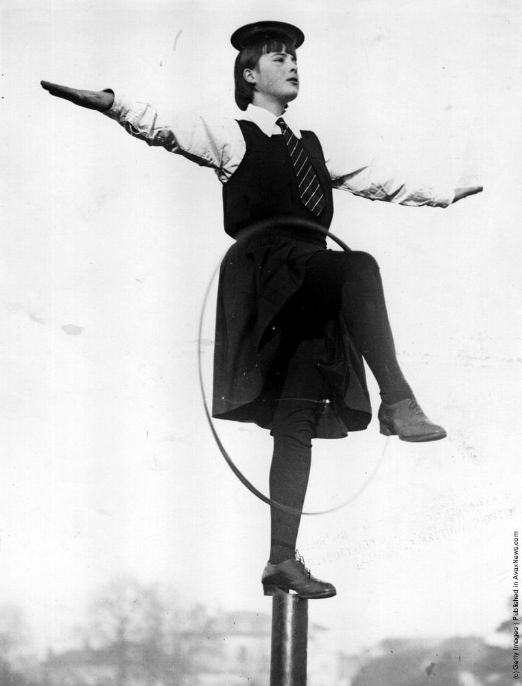 A school girl from Pengworn Ladies College, Cheltenham learning the art of balancing to cultivate good carriage in walking, 1936.