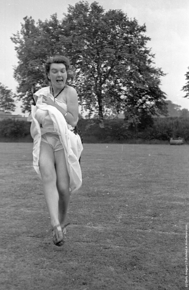 A student shows a little more leg than necessary at a cricket match at the Goldsmith's Art College end of term party in London, 1939.