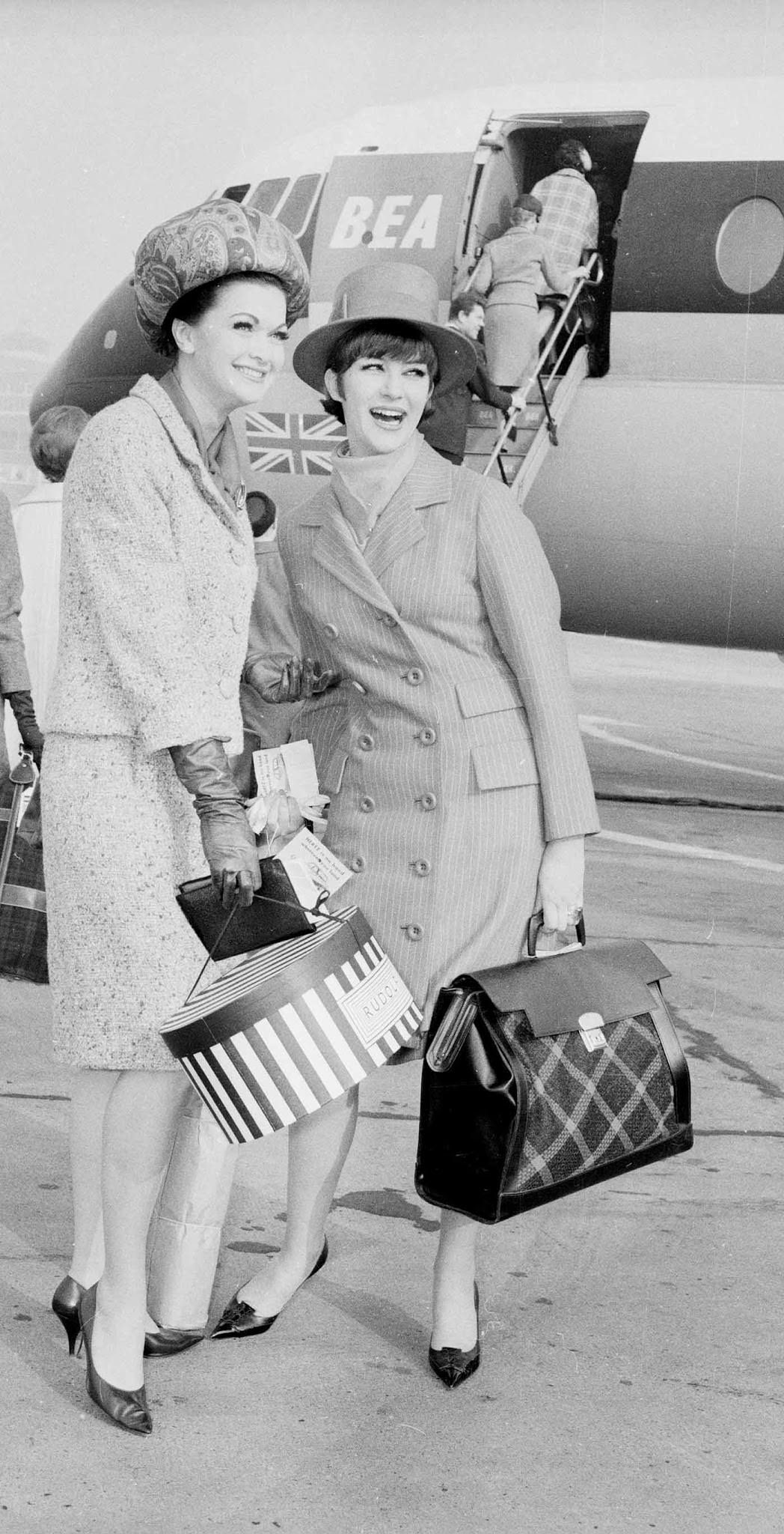 Air hostesses Penny Gillard and Jackie Bowyer prepare to board a BEA passenger plane for Paris, 1963.