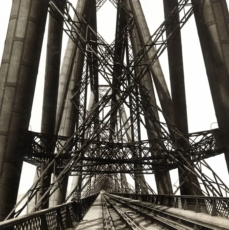 A view through the Forth Bridge, spanning the Firth of Forth, Scotland, 1902.