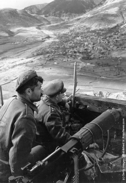 Monarchist soldiers armed with a machine gun guarding a mountain garrison at Karpenisi during the Greek Civil War, 1948.