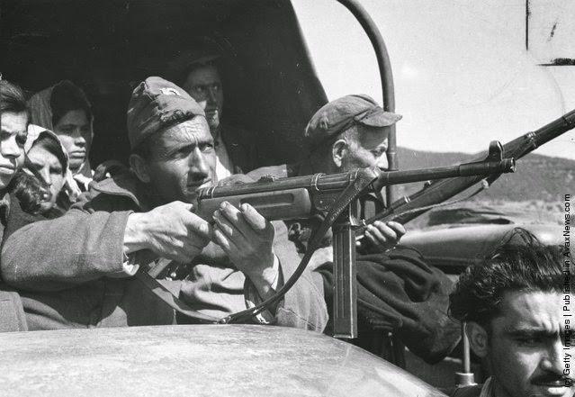 Greek National Guards bring prisoners from guerilla-occupied territory to Drama in northern Greece, 1948.