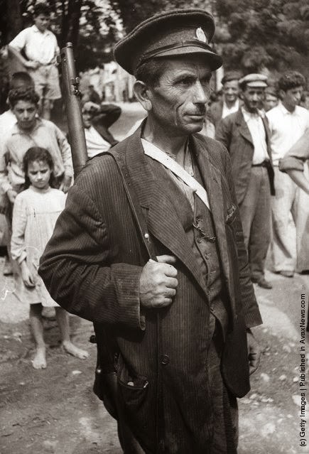 A Home Guard at Goumenissa, Macedonia, after an Andartes raid during the Greek Civil War, 1947.