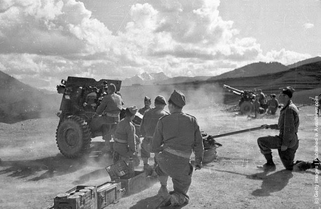 The Greek army opening fire on guerrilla troops during the Greek Civil War, 1948.