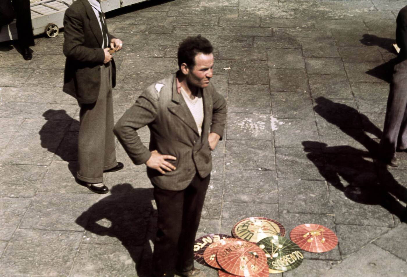 Souvenir vendor selling strawhats, Capri, Italy, 1939.