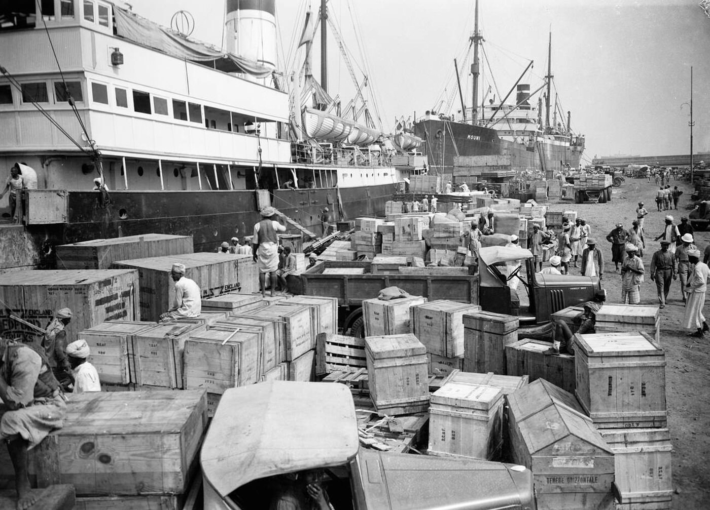 The docks at Massawa piled high with all kinds of war supplies, 1935.