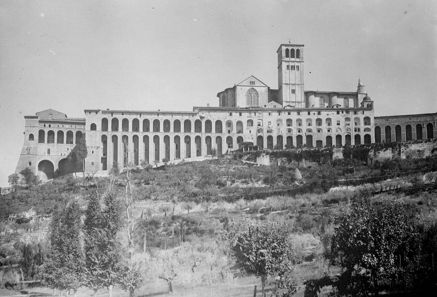 A striking view of Assisi, showing the upper and lower Basilicas of St Francis, 1930.