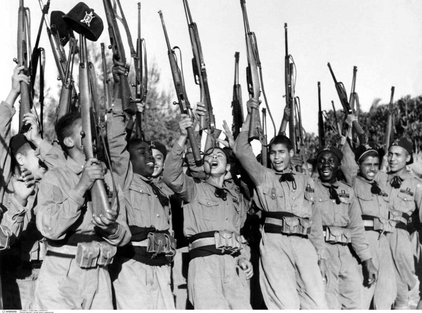 Local teenager in the Italian fascistic militia jubilate, Libya, 1930s.
