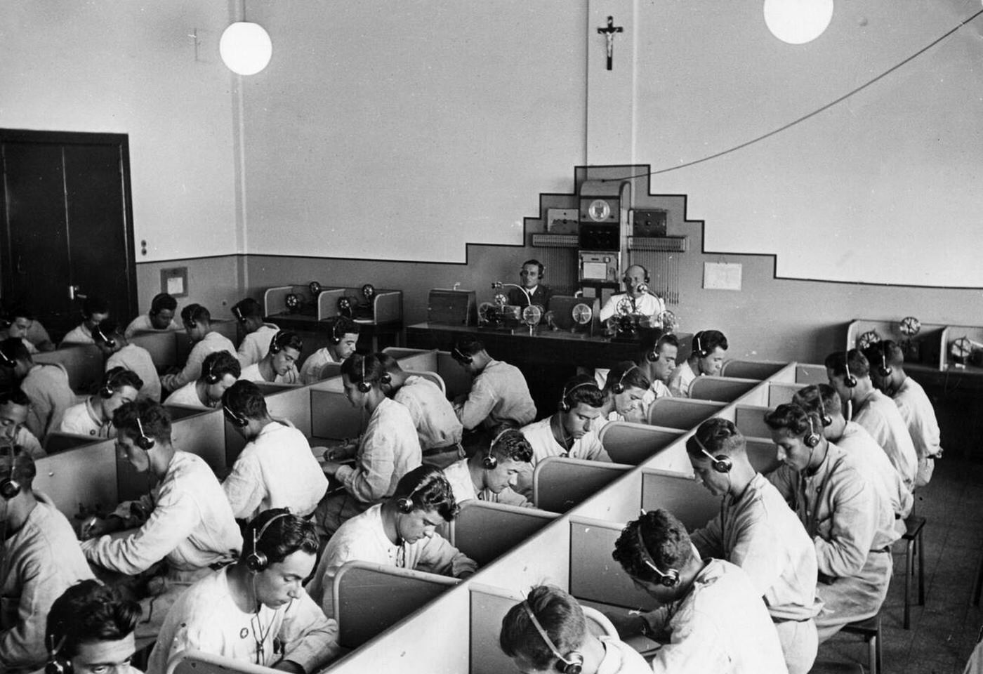 Radio operators during a lesson, aviation school of the Regia Aeronautica, Italy, 1930s.
