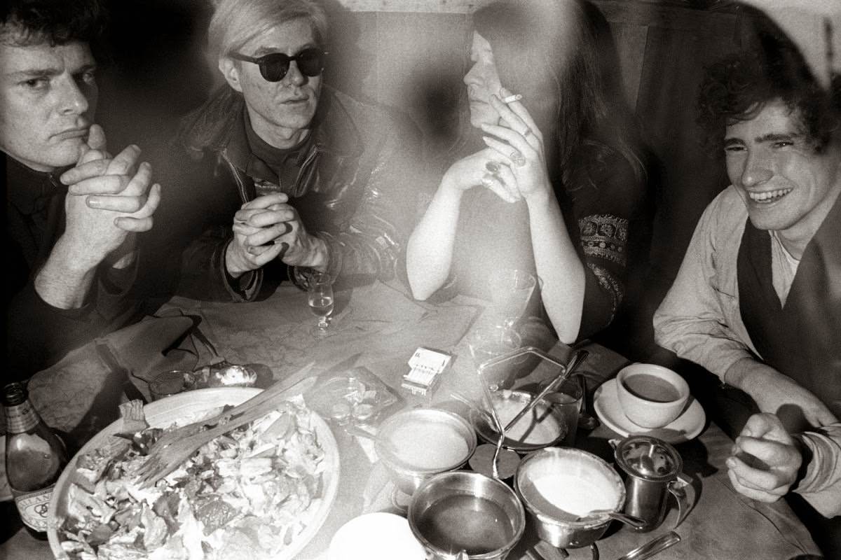 Hanging out in Max's Kansas City restaurant in New York City. From left to right: Paul Morrissey, Andy Warhol (sunglasses), Janis Joplin and Tim Buckley.