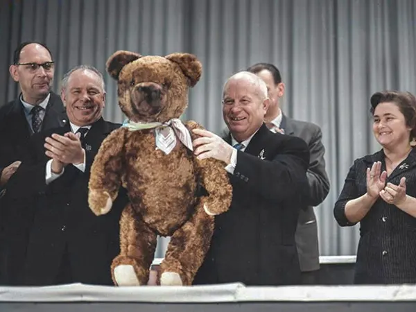 Nikita Khrushchev with a teddy bear presented by workers at Berlin television electronics plant, 1963.