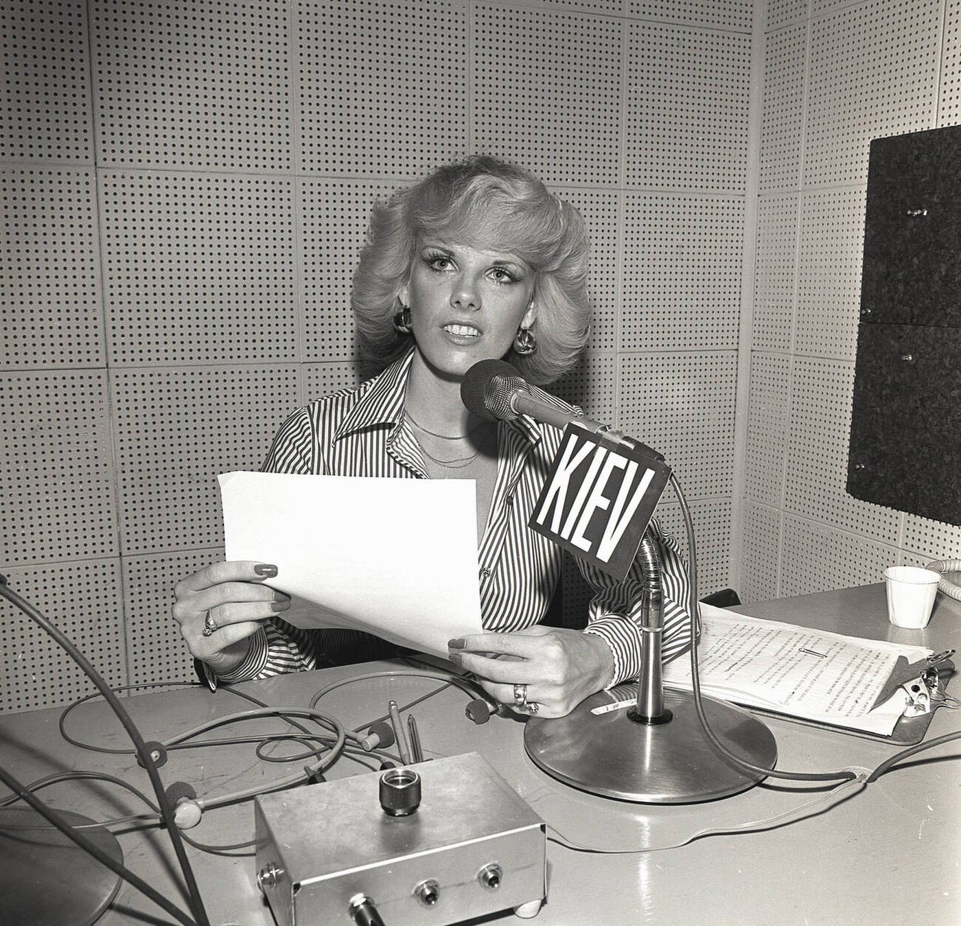 Blonde female radio news announcer broadcasting to Kiev, Ukraine, 1950s.