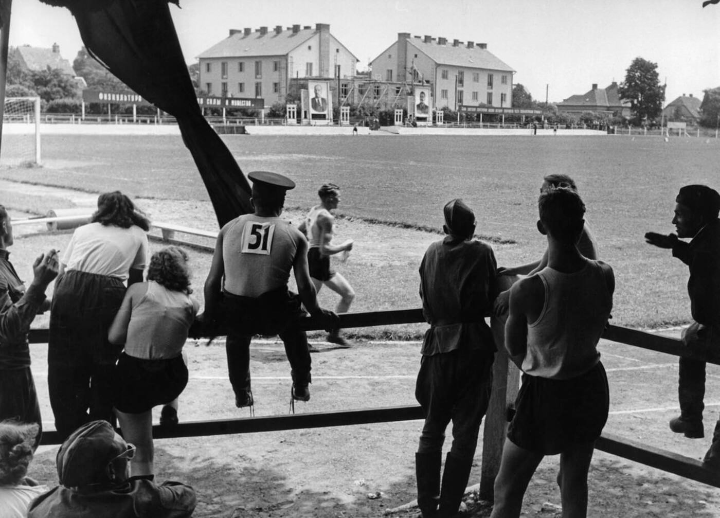 Soldiers of the Soviet Army follow a run with girlfriends, 1950s.