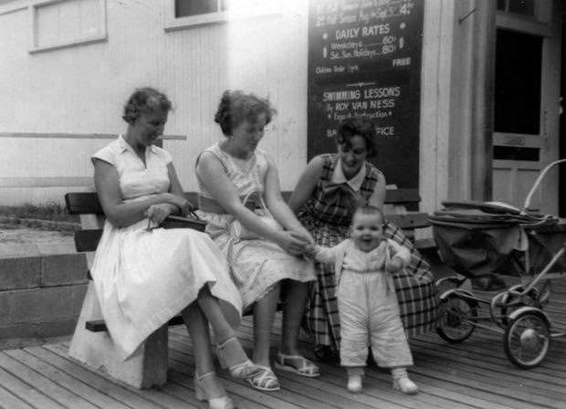 A young mother and her infant at the Jersey Shore, 1968.