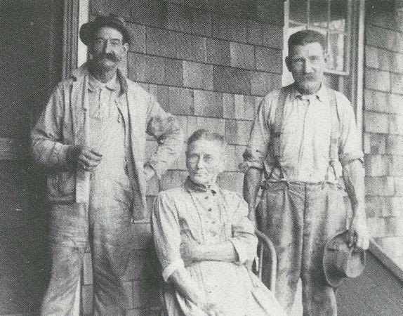 John Wagner and his brother, Bill, pose with their mother on the porch of their home in Leonardo.