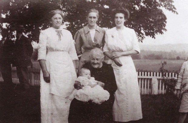 Five generations of the Swackhamer family in Ironia, Randolph Township; Eliza Hopkins Swackhamer is seated in the center holding her great-great-granddaughter, Lois Ann Watters, while Lois’ grandmother, great-grandmother and mother stand from left to right, 1914.