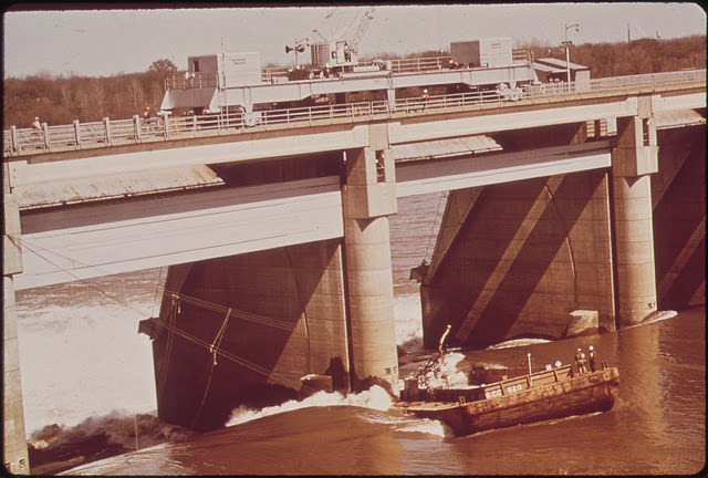 A Liquid Chlorine Barge, After Breaking Loose From Its Tug Became Lodged Against The Mcalpine Dam On The Ohio River And Could Not Be Set Free, March 1972