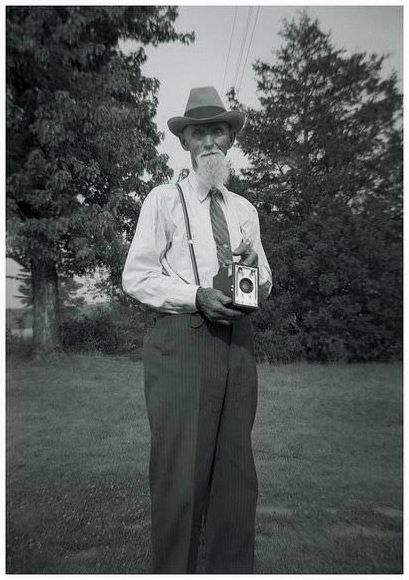 A farmer from Worthington, Missouri, USA, with his Kodak box camera.