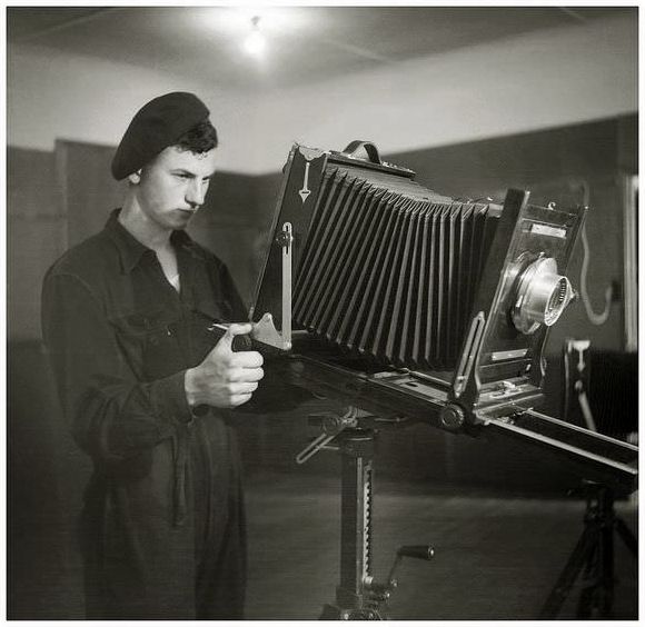Aircraftsman Ron Jeffs of the Royal Australian Air Force undergoes training with a 10x8 Ansco view camera at the School of Photography, East Sale, Victoria, Australia, in 1949.