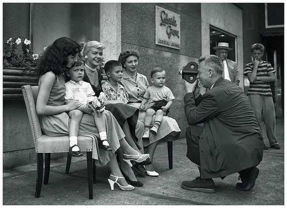 A newsreel cameraman captures families at the Democratic National Convention held at the Hilton Hotel, Chicago, in July, 1952.